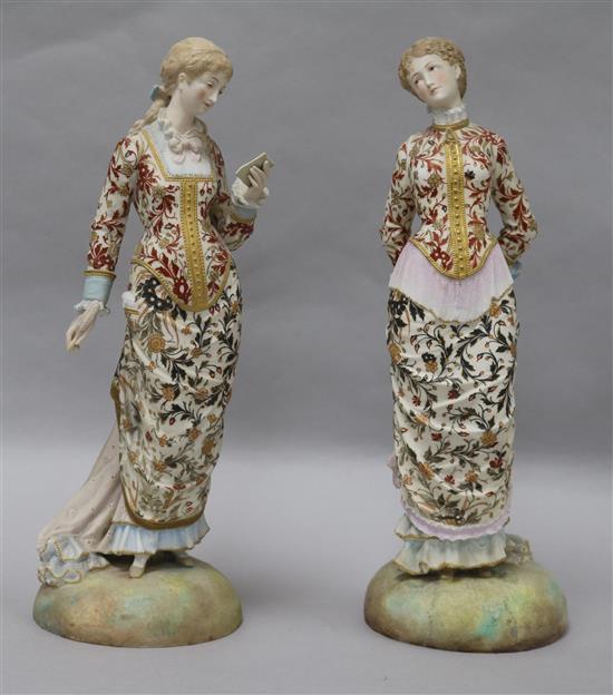 Two French painted biscuit porcelain figures of elegant ladies, late 19th century, height 35.5cm and 36cm